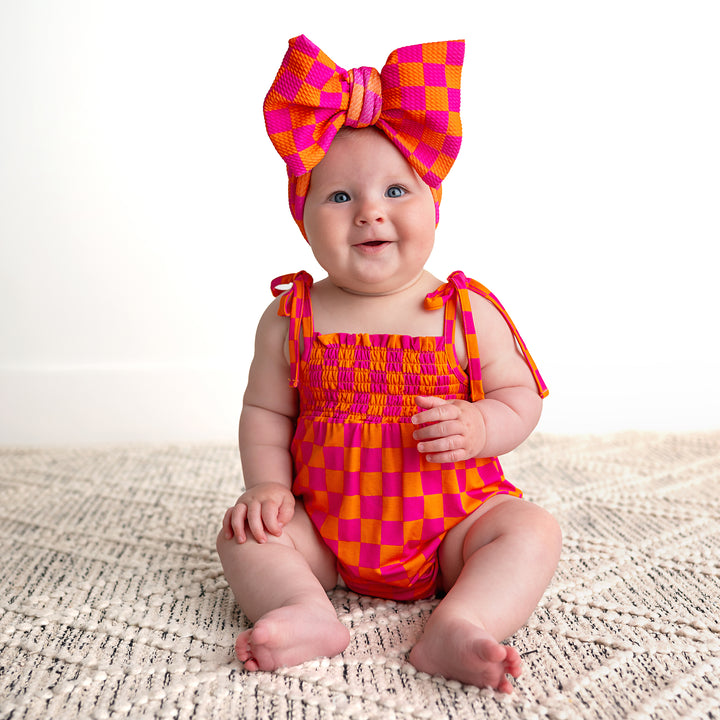 Eric Orange SMOCKED BUBBLE ROMPER - Gigi and Max